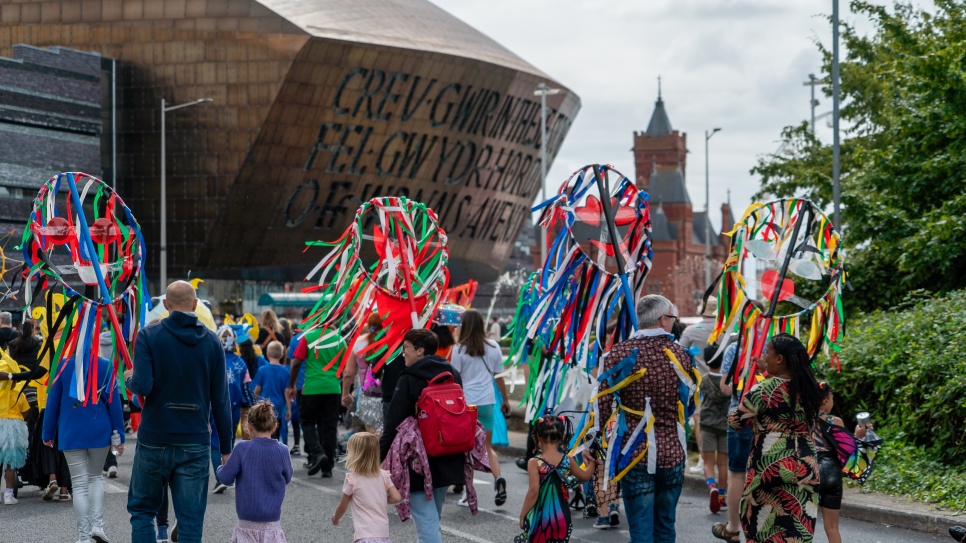 Butetown Carnival with the Wales Millennium Centre in the background