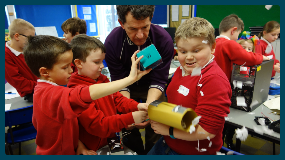 A picture of a group of children enjoying a creative learning session led by a facilitator