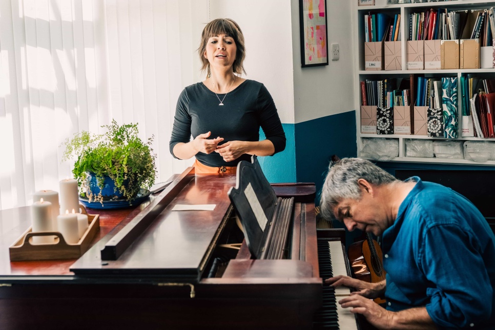 Photograph of Angharad Jenkins and Huw Warren at a piano / Ffotograff o Angharad Jenkins a Huw Warren wrth biano