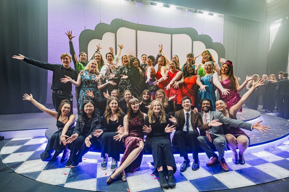 the cast of Sweet Charity together on stage
