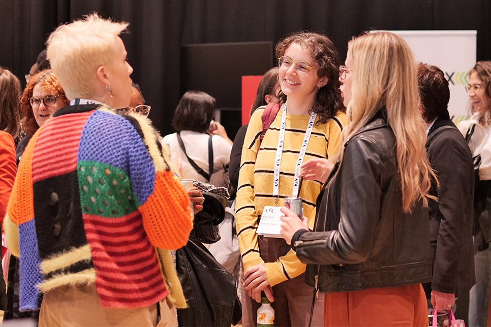 Photograph of delegates talking at AMA Conference 2024 / Ffotograff o gynrychiolwyr yn siarad yng Nghynhadledd AMA 2024