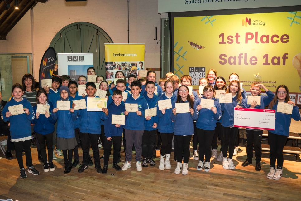 School pupils holding certificates of the na nÓg Awards